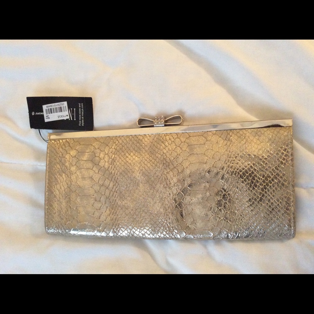 Inc snake print clutch,with rhinestone bow